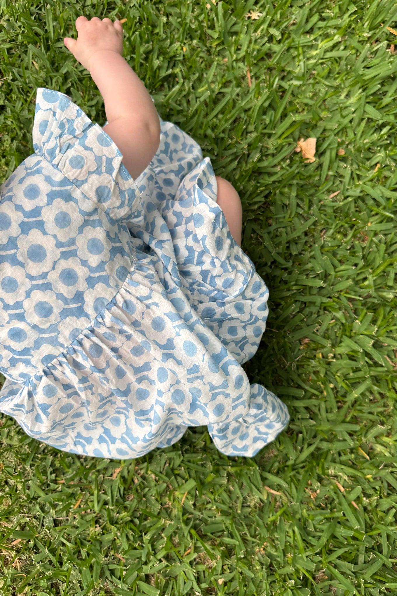 Juni Kids pure cotton blockprint baby dress in light blue and white floral pattern.