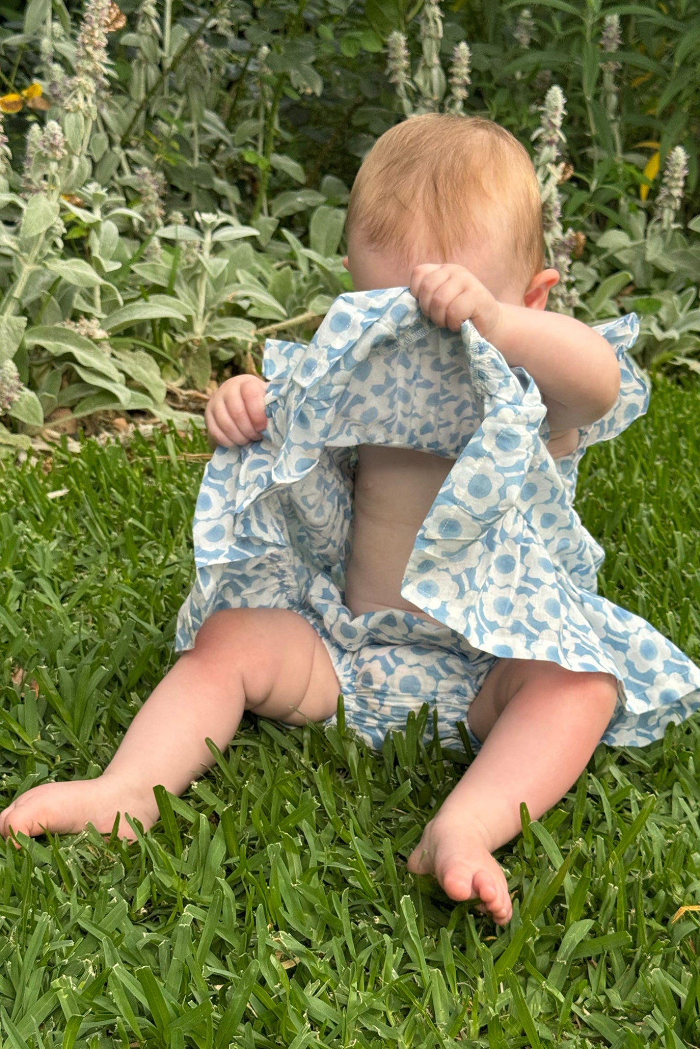 Juni Kids pure cotton blockprint baby dress in light blue and white floral pattern.