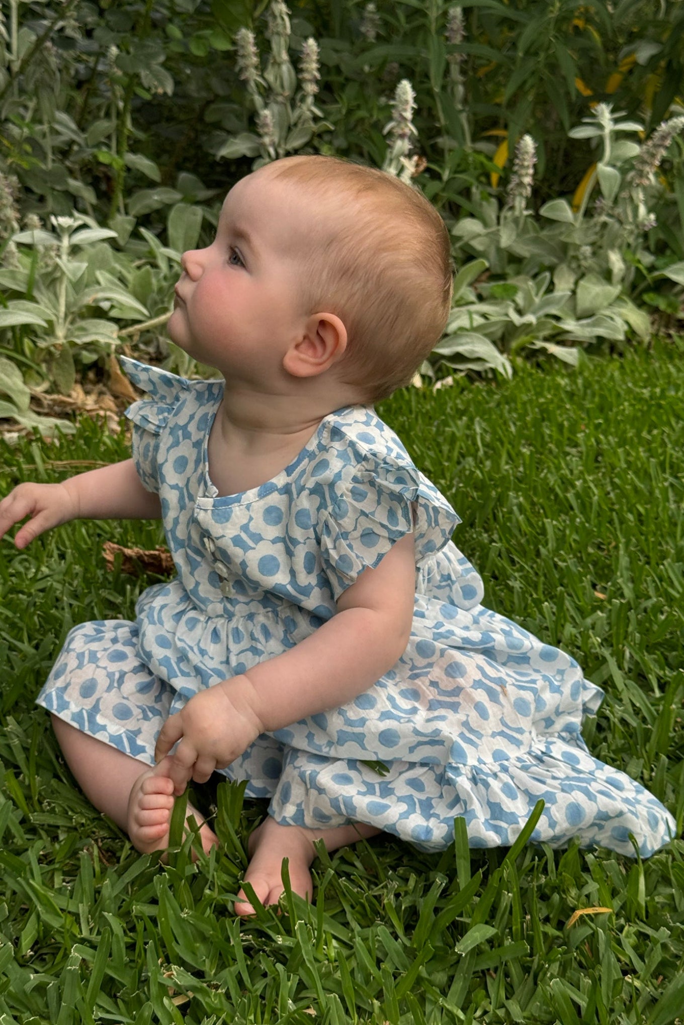 Juni Kids pure cotton blockprint baby dress in light blue and white floral pattern.