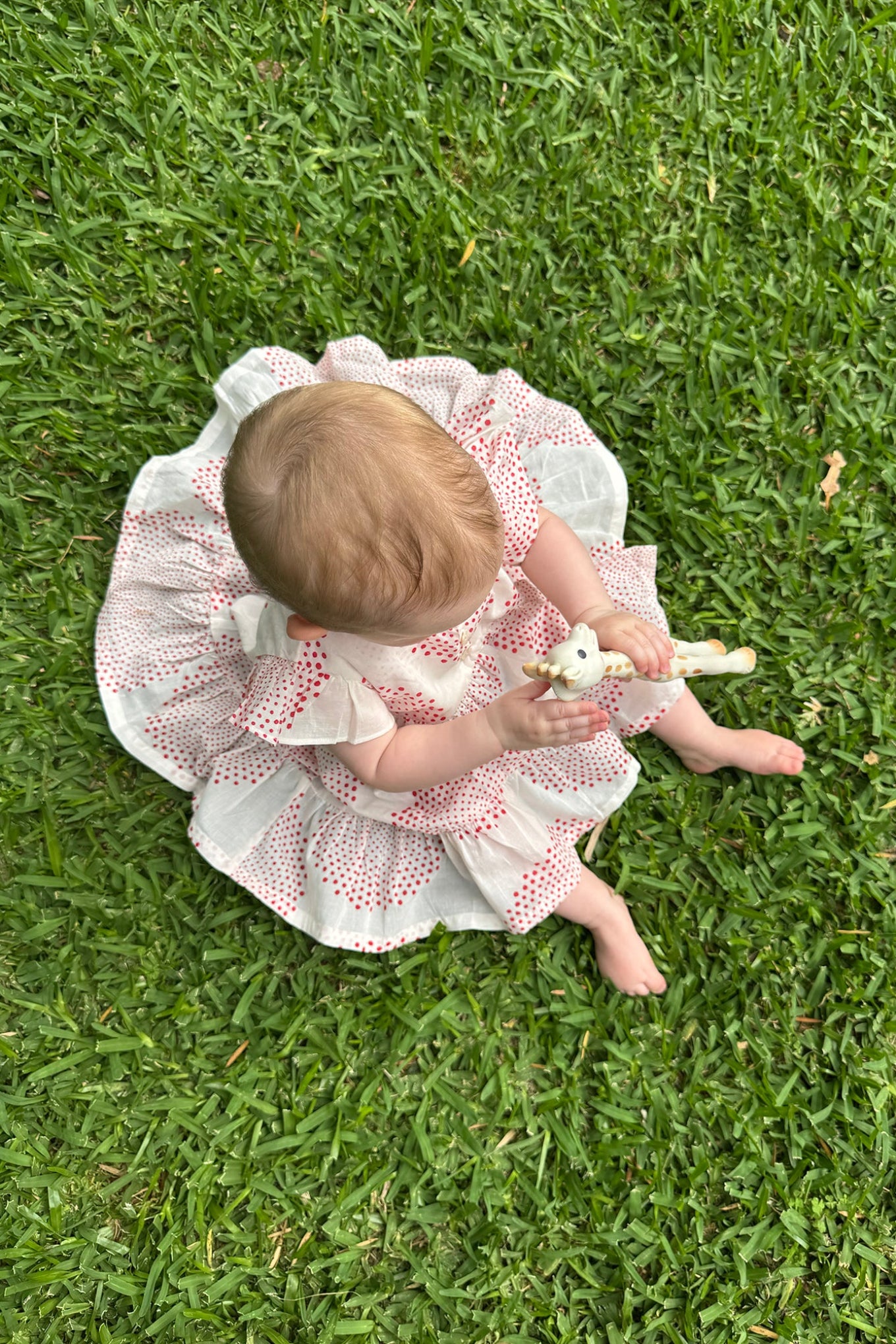 Juni Kids pure cotton blockprint baby dress in red circle dots on white.