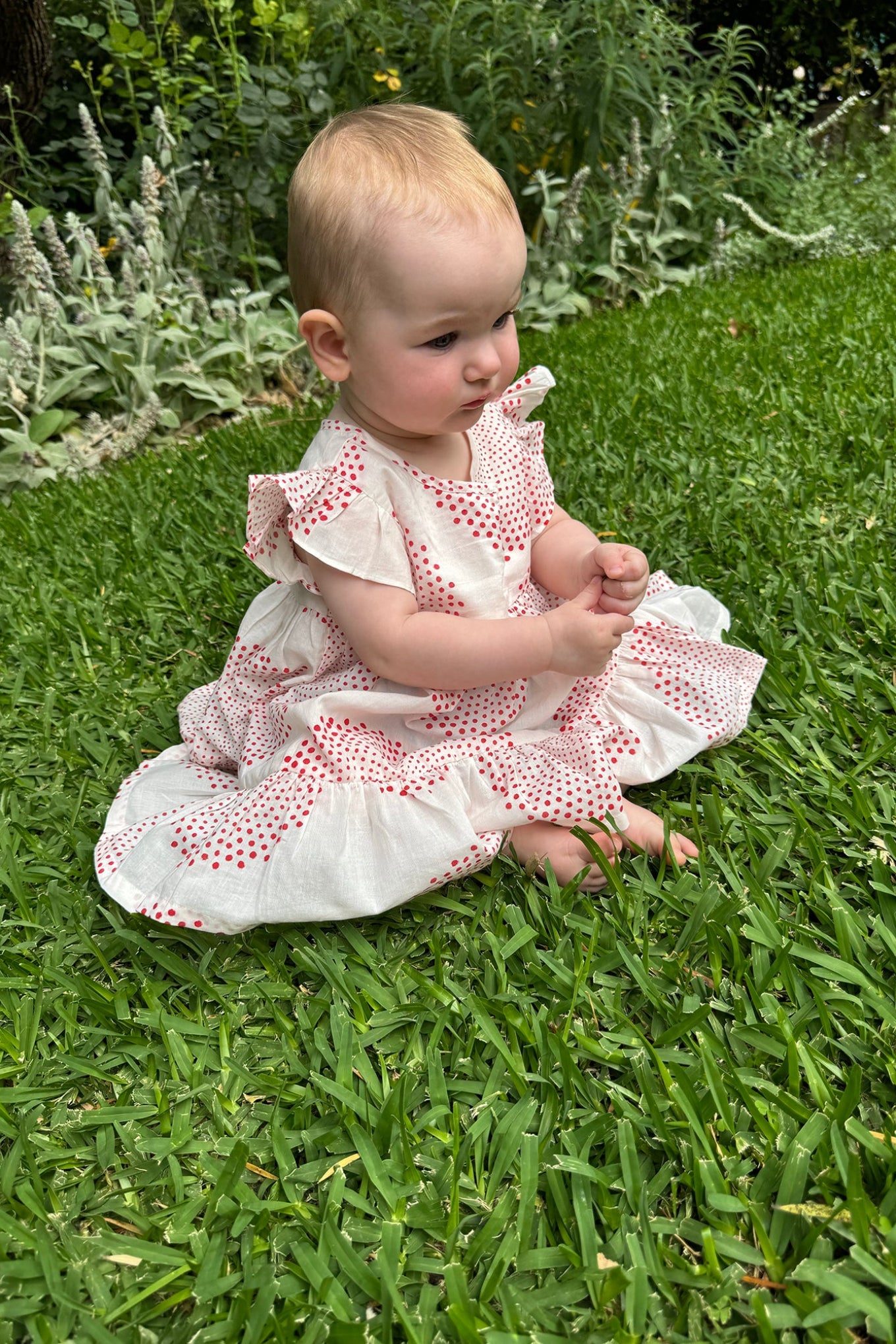Juni Kids pure cotton blockprint baby dress in red circle dots on white.