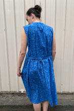 Load image into Gallery viewer, Juniper hearth Zoe dress button up sleeveless with waist ties, made from cotton cornflower blue blockprint floral.