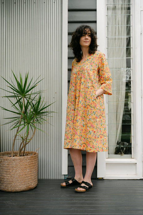 Juniper Hearth blockprint cotton Thea 3/4 sleeve dress in saffron yellow floral design.