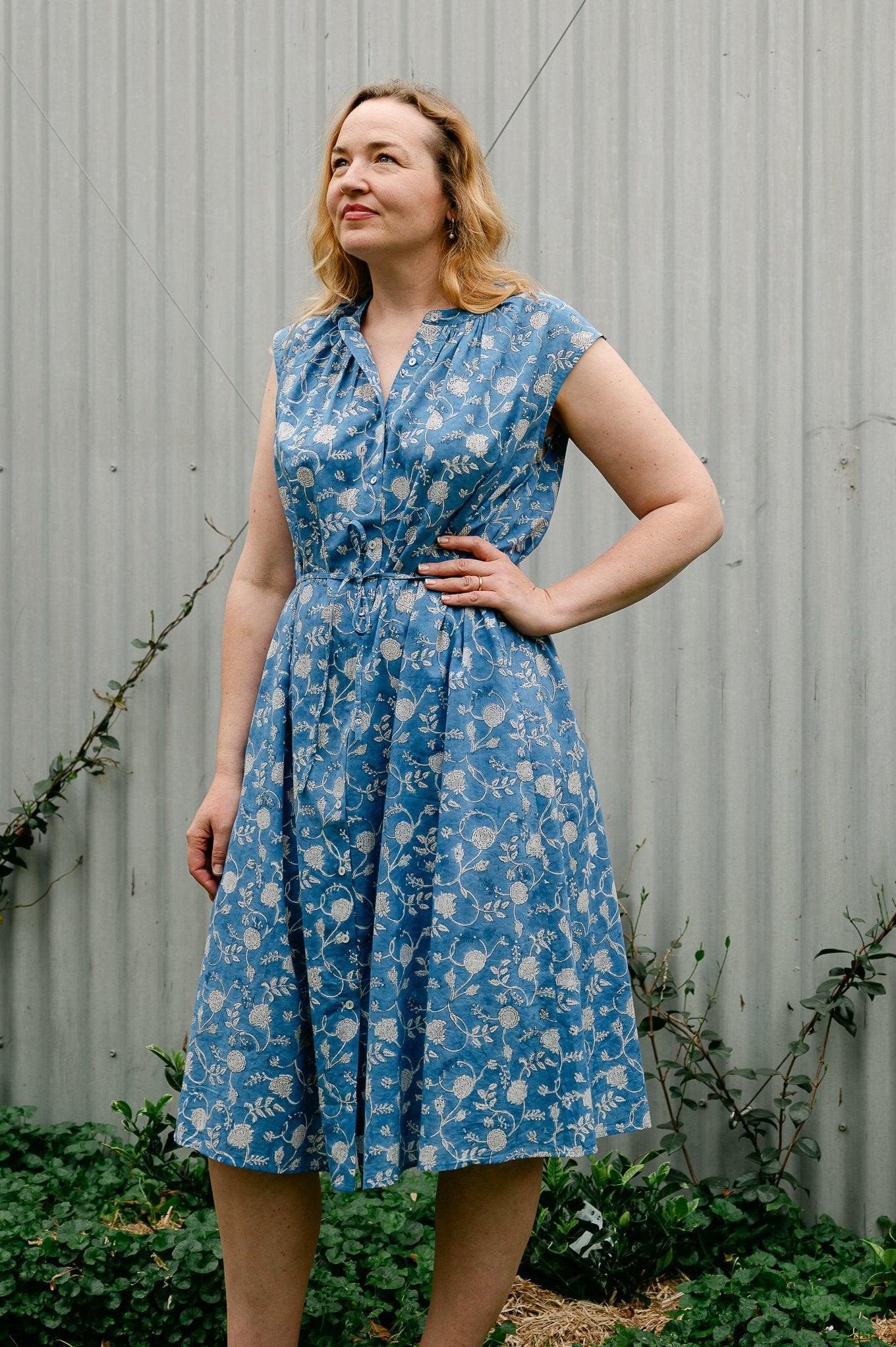 Juniper Hearth Zoe blockprint floral sleeveless cotton dress, buttonup with waist tie, in blue and white.