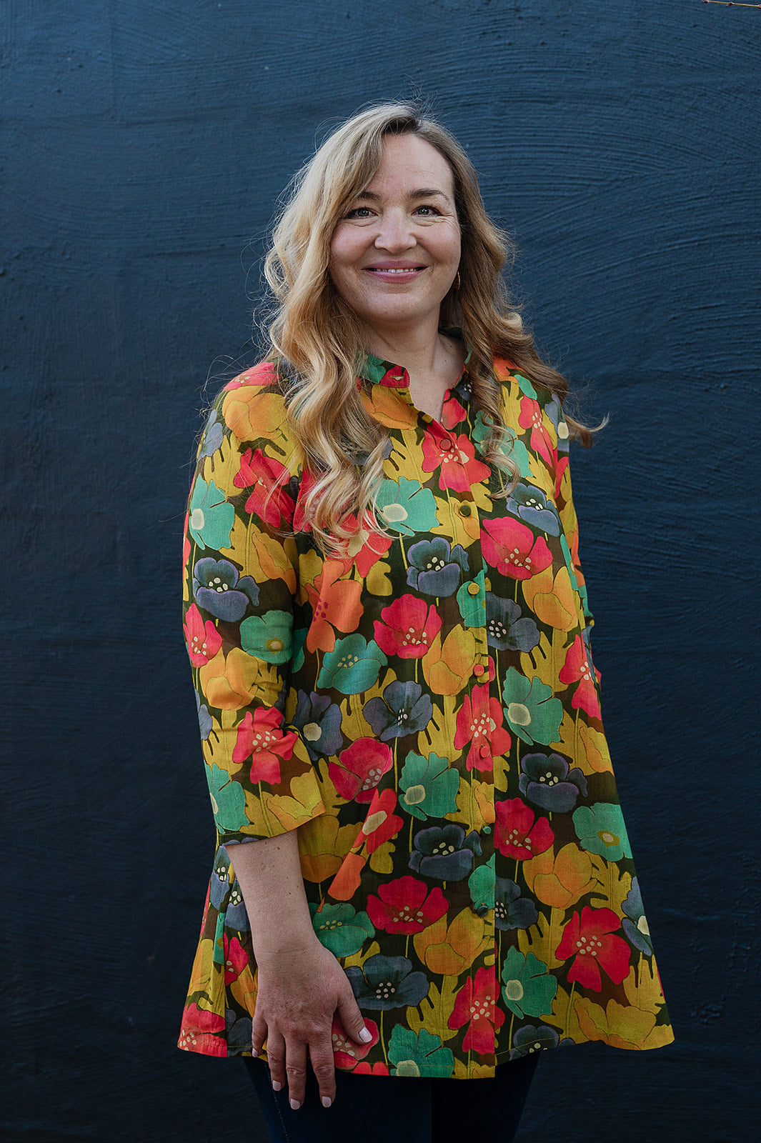 Neeru Kumar button-up shirt with a colorful floral pattern.