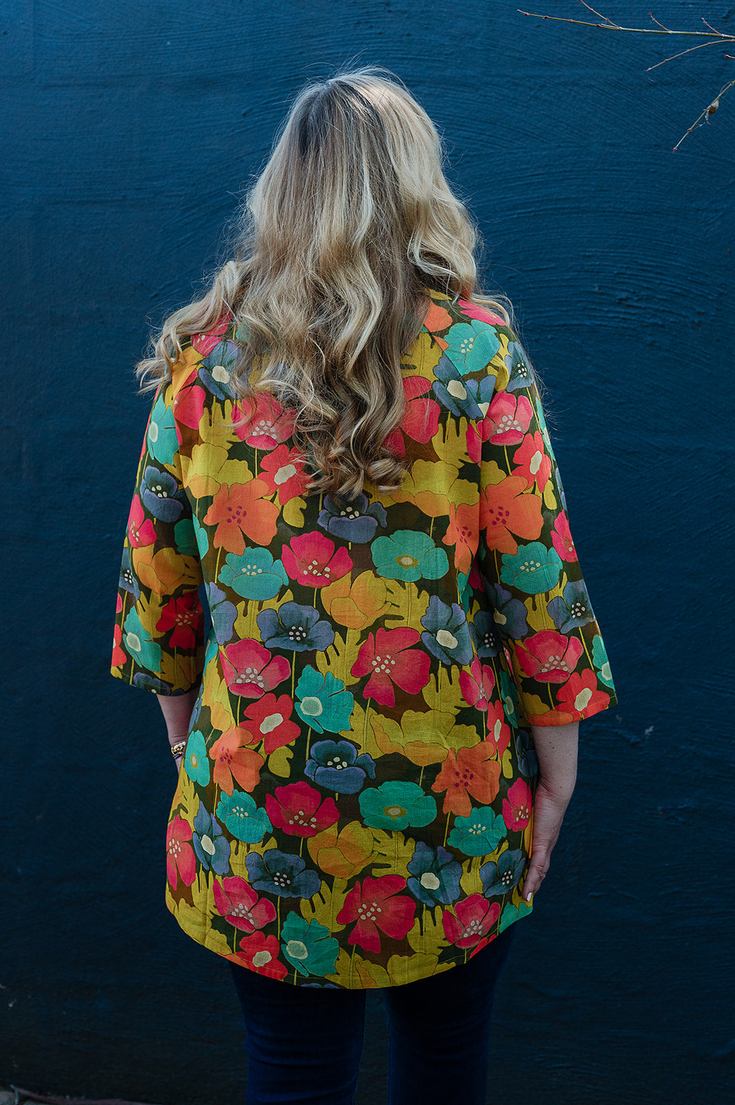 Neeru Kumar button-up shirt with a colorful floral pattern.