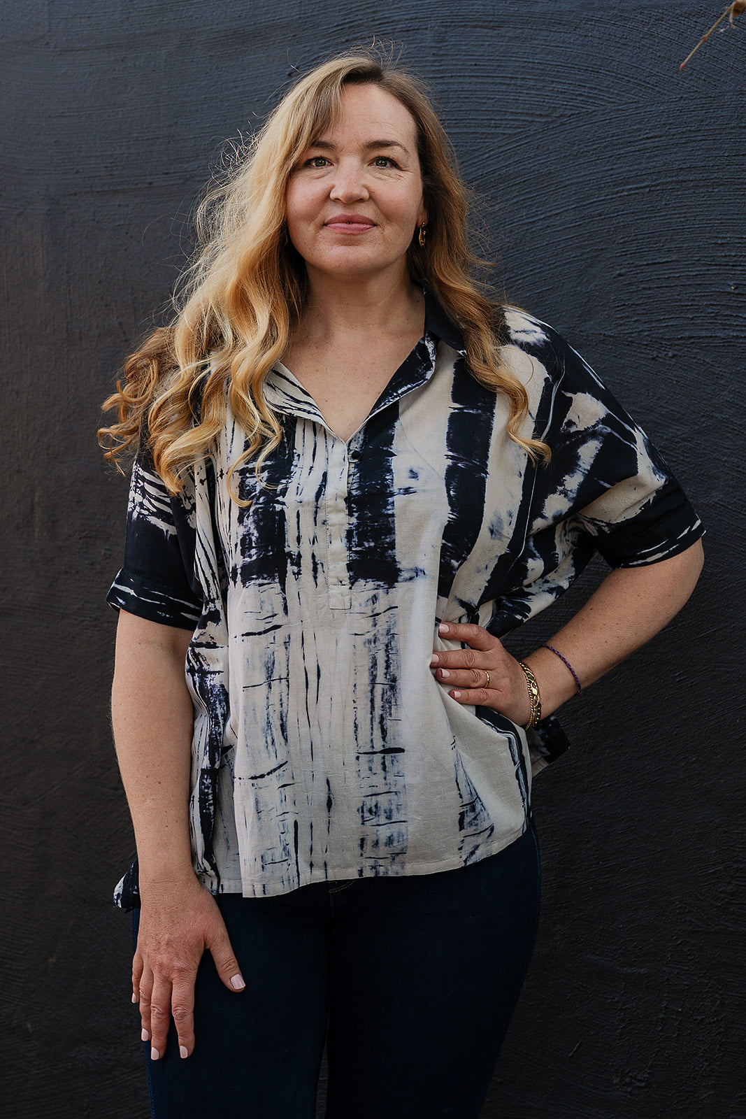 Neeru Kumar short-sleeve collared shirt with a black and white shibori tie-dye pattern.