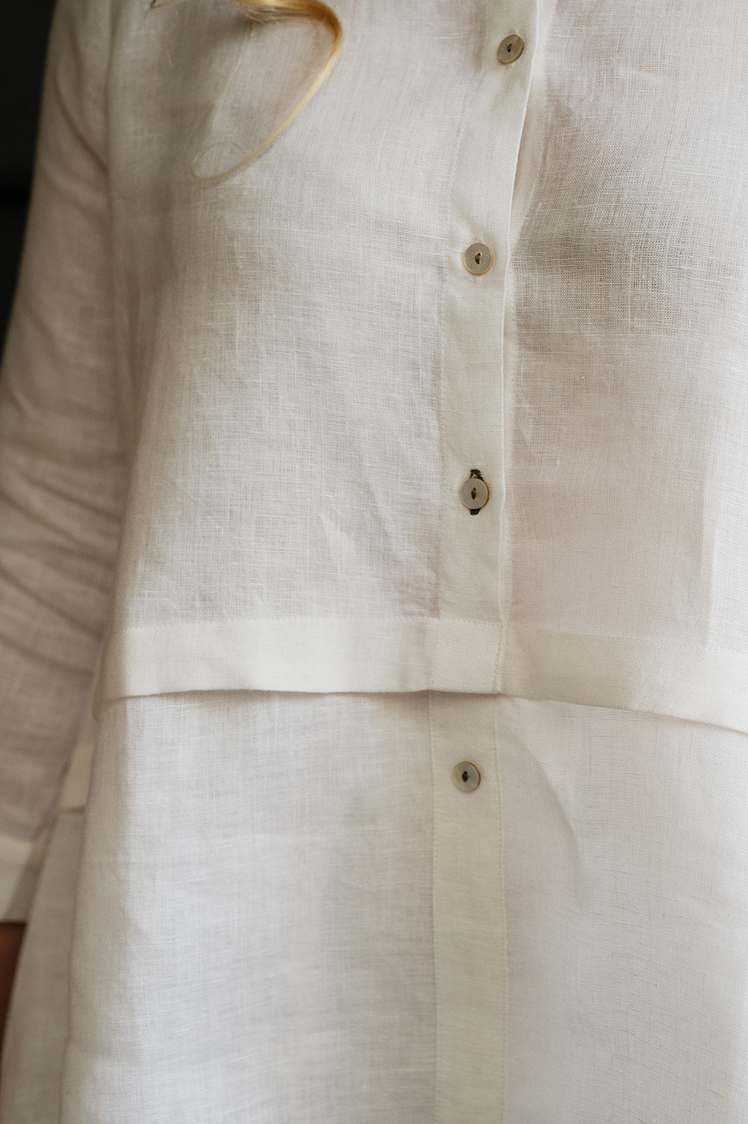 Manan Anaya white linen shirt with tailored seam detailing.