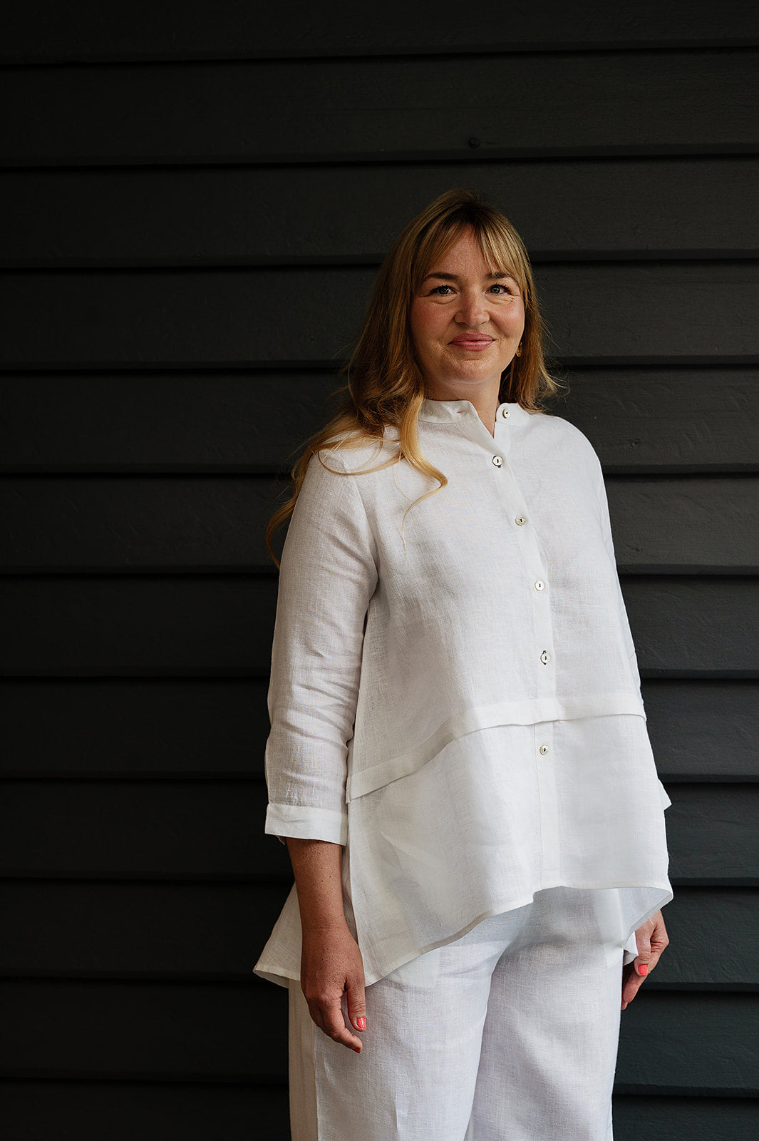 Manan Anaya white linen shirt with tailored seam detailing.