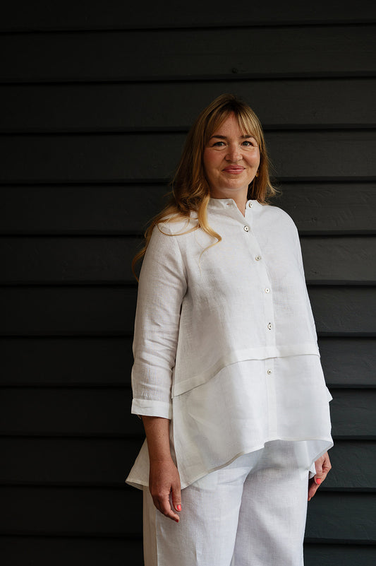 Manan Anaya white linen shirt with tailored seam detailing.