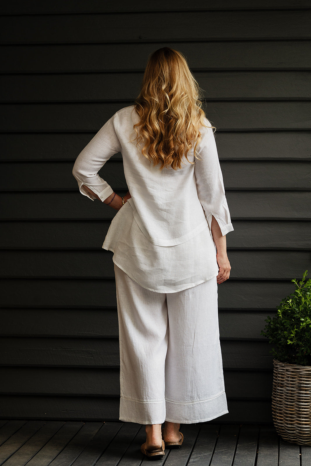 Manan Anaya white linen shirt with tailored seam detailing.