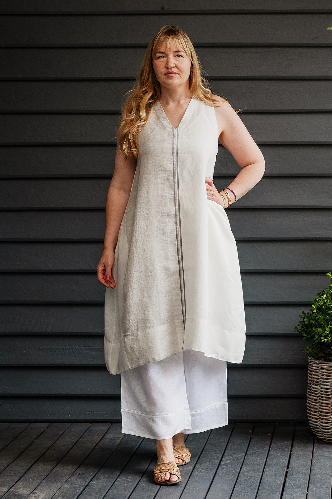 Manan Ayana V-neck sleeveless linen tunic dress with handwoven metallic border, stripe panels, selvedge detailing and hand-embroidery.
