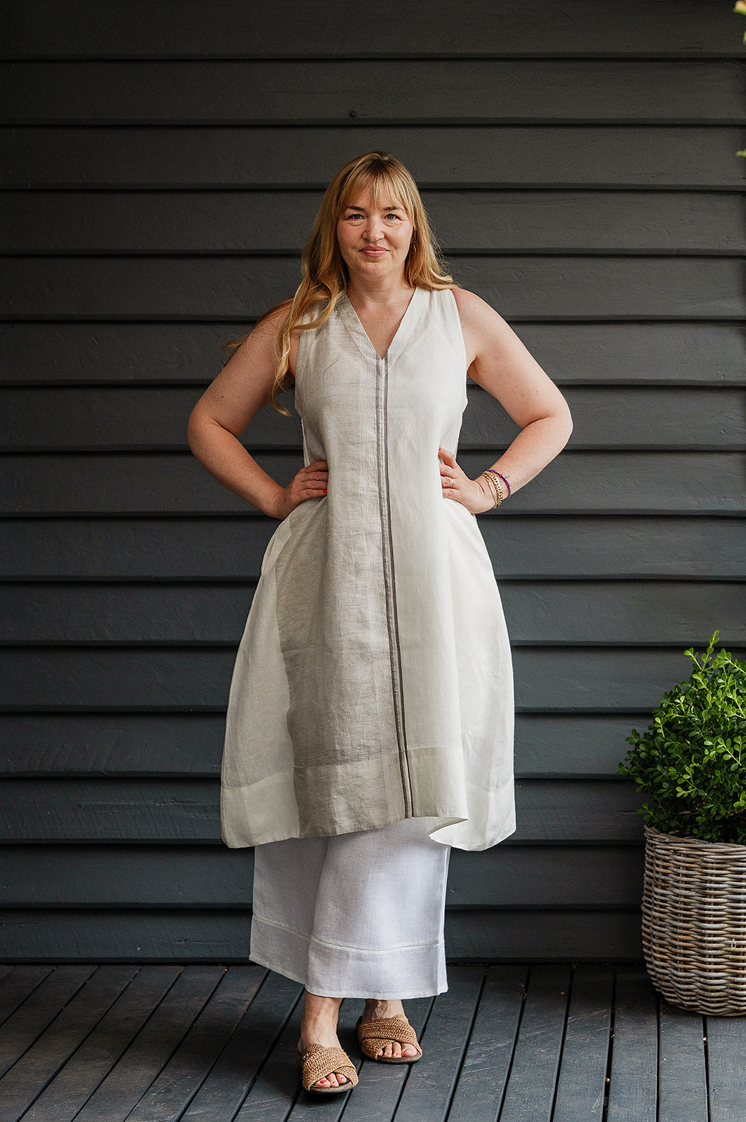 Manan Ayana V-neck sleeveless linen tunic dress with handwoven metallic border, stripe panels, selvedge detailing and hand-embroidery.