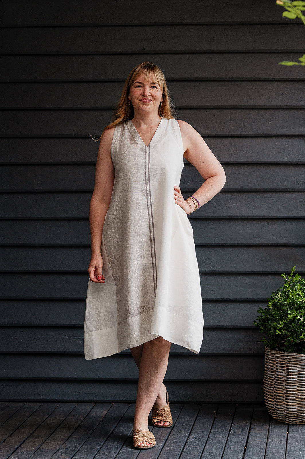 Manan Ayana V-neck sleeveless linen tunic dress with handwoven metallic border, stripe panels, selvedge detailing and hand-embroidery.