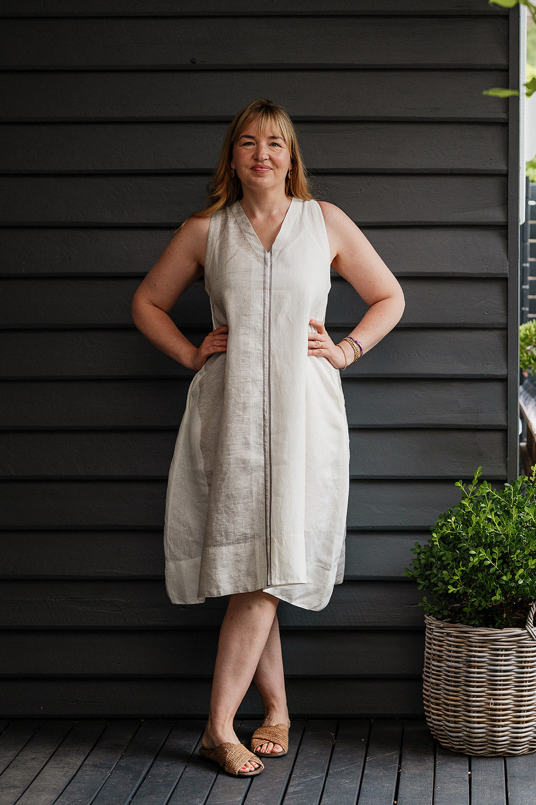 Manan Ayana V-neck sleeveless linen tunic dress with handwoven metallic border, stripe panels, selvedge detailing and hand-embroidery.