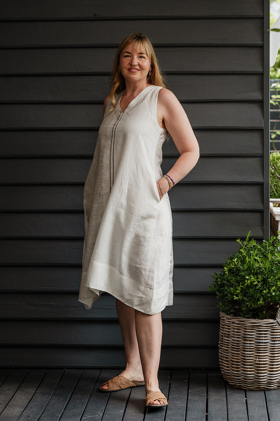 Manan Ayana V-neck sleeveless linen tunic dress with handwoven metallic border, stripe panels, selvedge detailing and hand-embroidery.