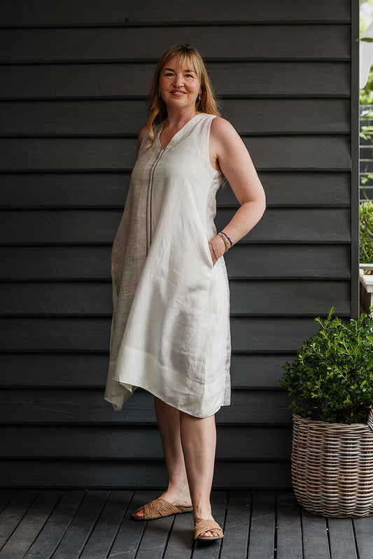 Manan Ayana V-neck sleeveless linen tunic dress with handwoven metallic border, stripe panels, selvedge detailing and hand-embroidery.