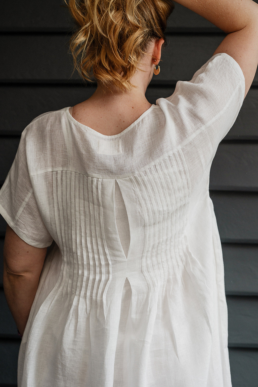 Manan Rasa sheer white linen dress with short sleeves, pleat detailing at the back.