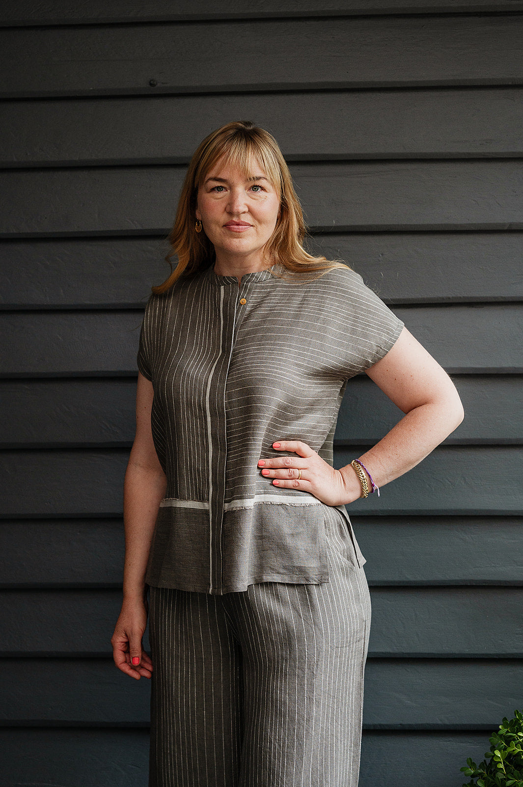 Manan Madhavi button up top in yarn-dyed grey and white stripe linen with panel detailing.