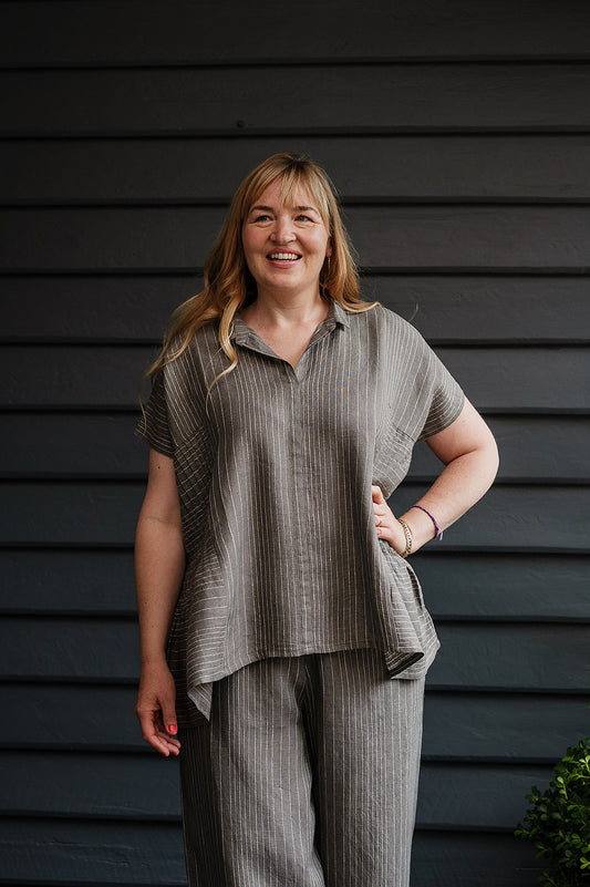 Manan Bonnie loose-fitting button up top with side pleat detailing in yarn-dyed stripe grey and white linen.