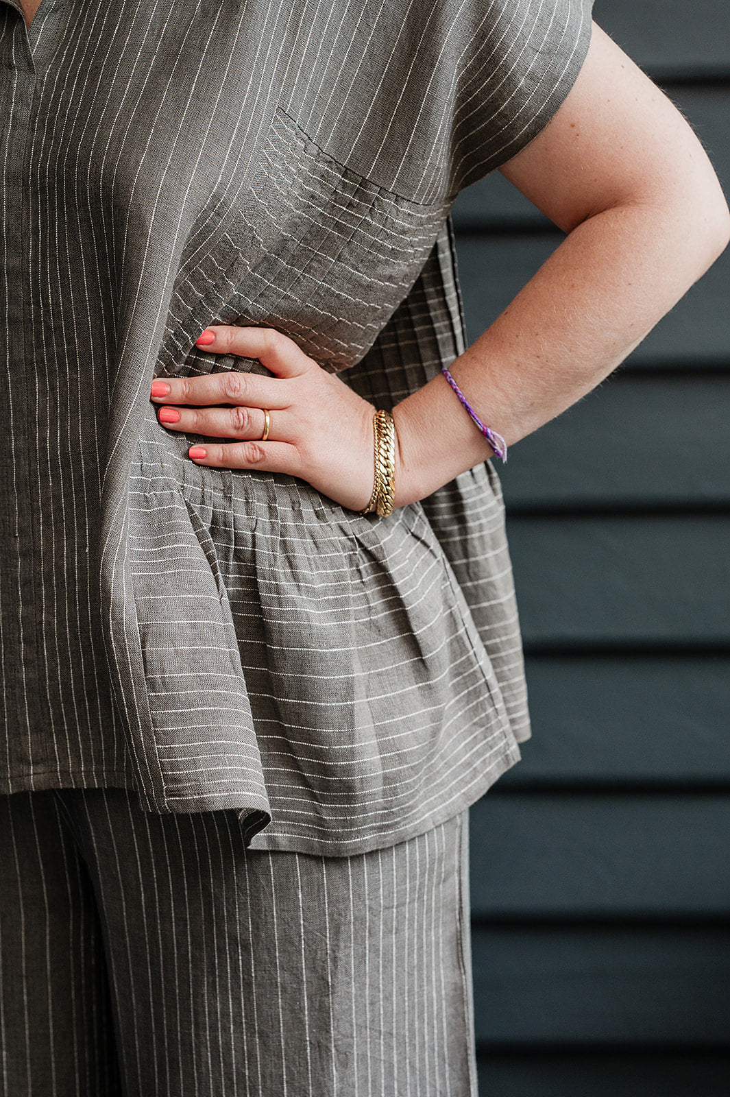 Manan Bonnie loose-fitting button up top with side pleat detailing in yarn-dyed stripe grey and white linen.