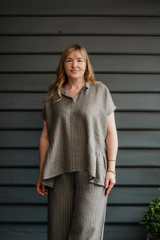 Manan Bonnie loose-fitting button up top with side pleat detailing in yarn-dyed stripe grey and white linen.