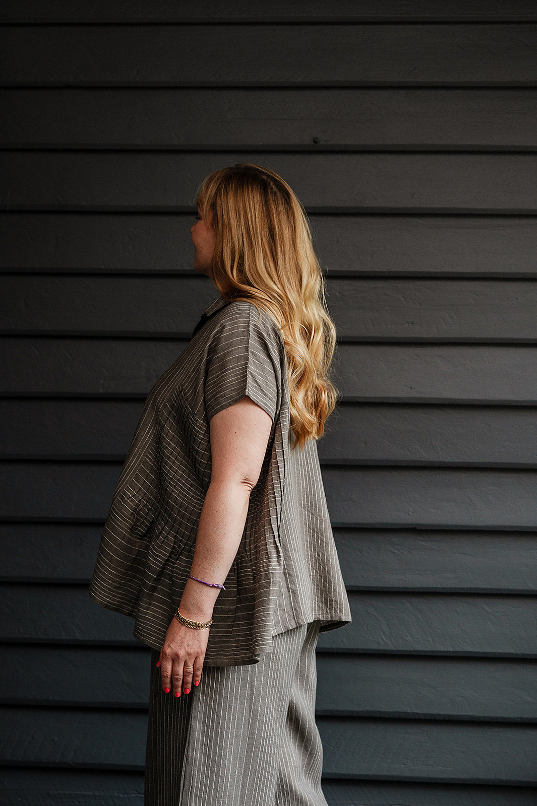 Manan Bonnie loose-fitting button up top with side pleat detailing in yarn-dyed stripe grey and white linen.
