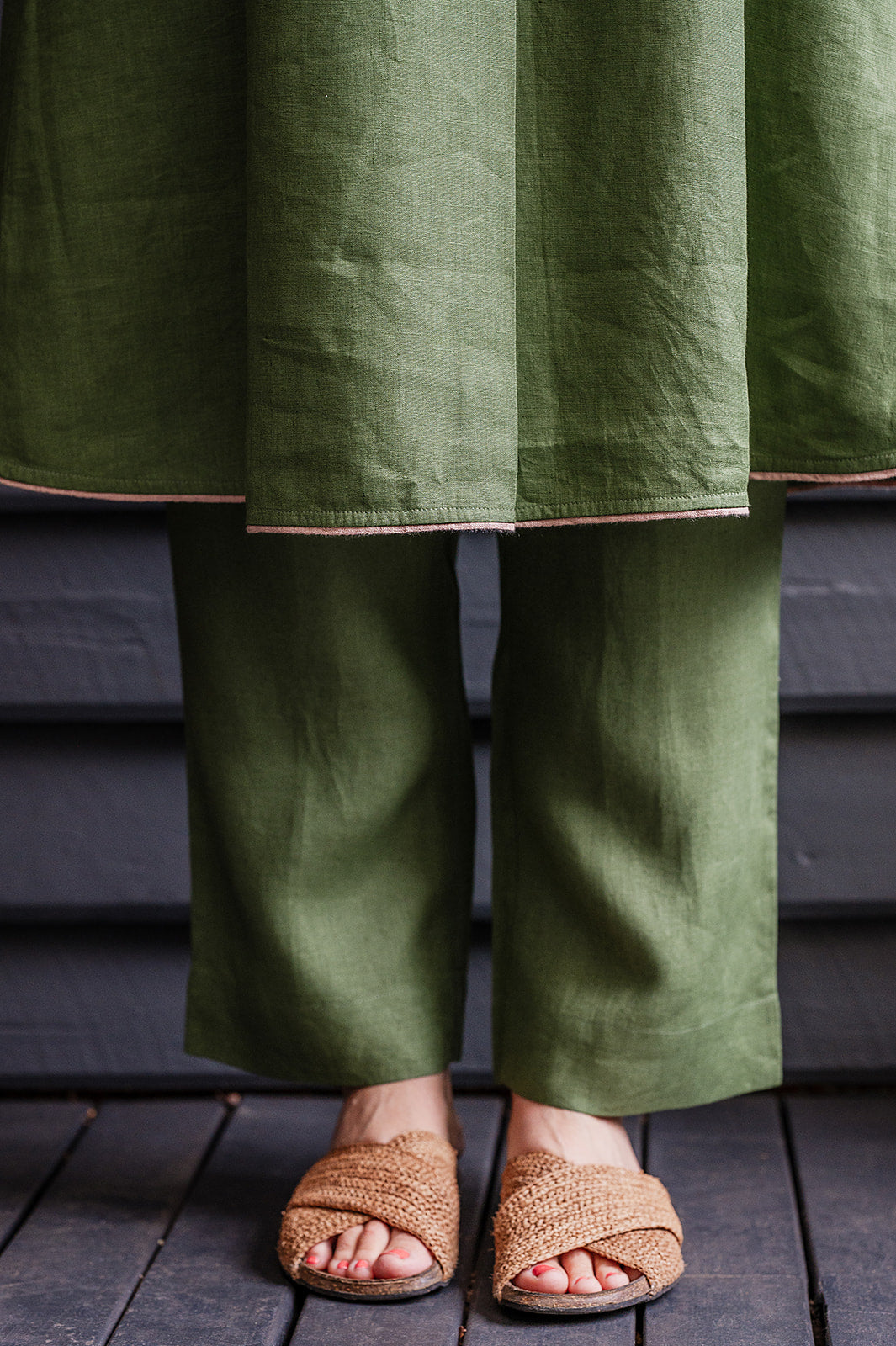 Manan Maki pleated linen short sleeve dress with V-neck in green.