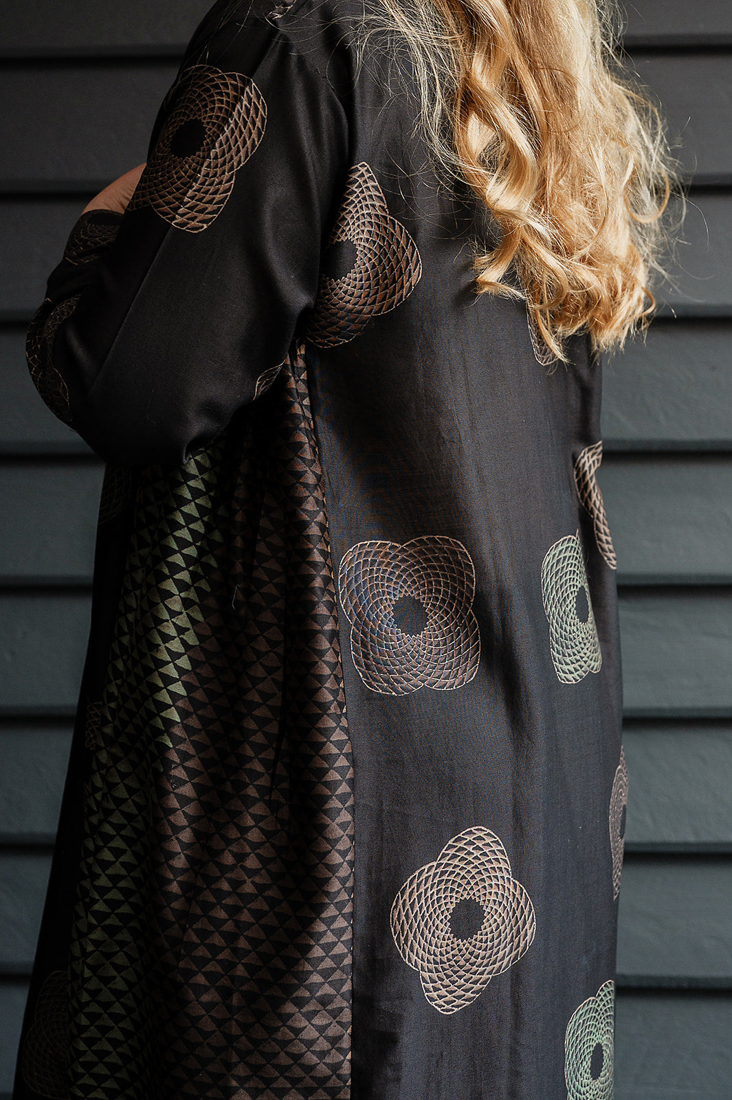 Brahma Karma chanderi cotton silk ebony tunic dress with bronze flowers and geometric side panels.