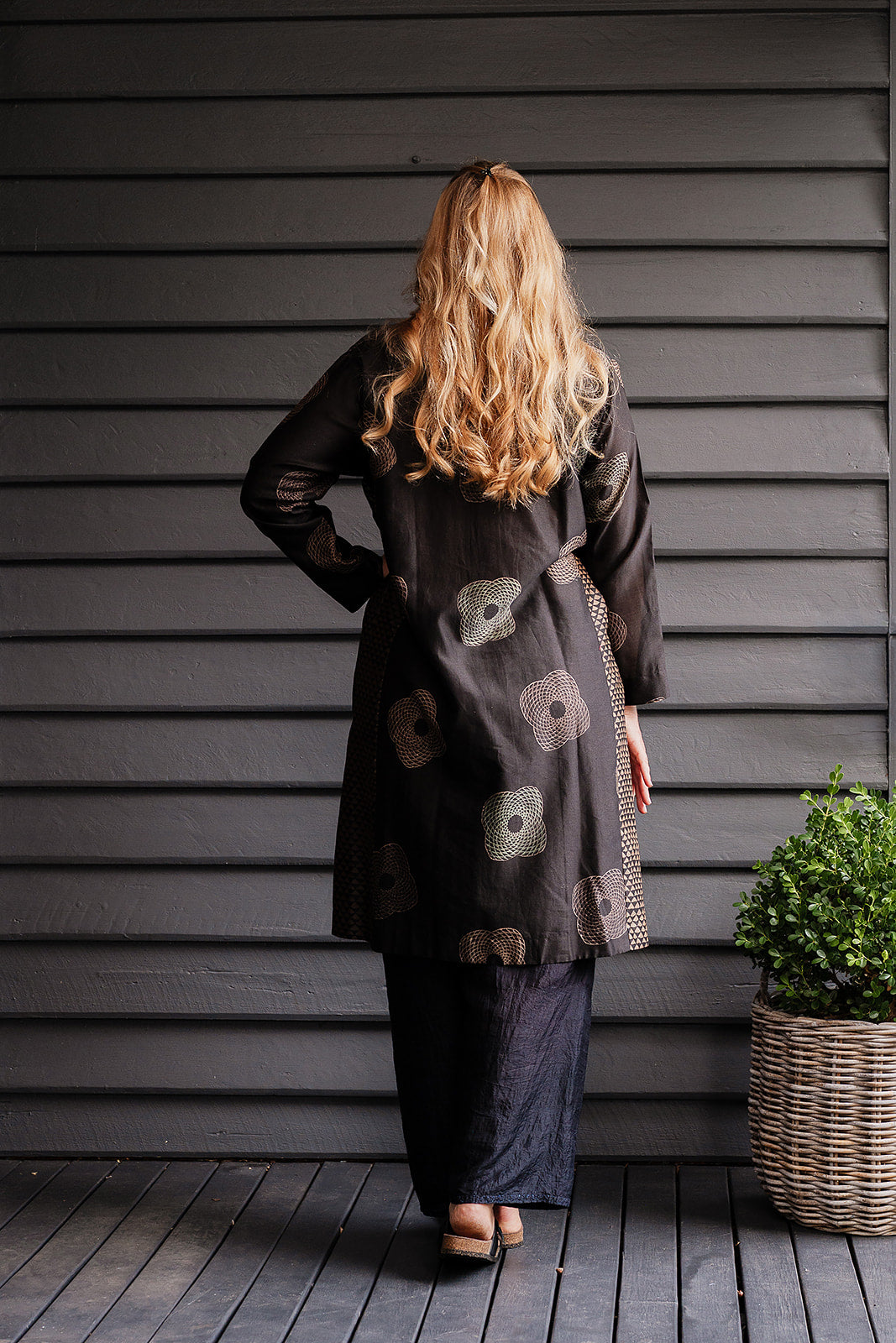 Brahma Karma chanderi cotton silk ebony tunic dress with bronze flowers and geometric side panels.