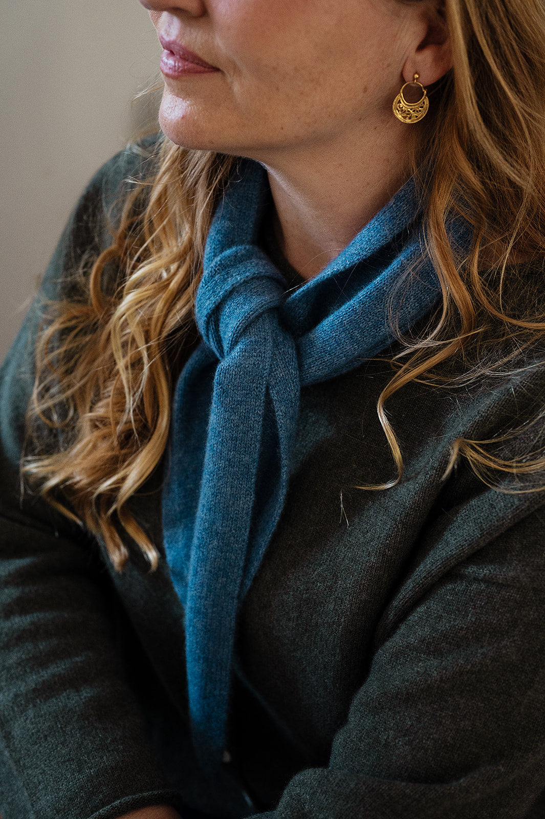 Cashmere triangle neck scarf in denim blue.