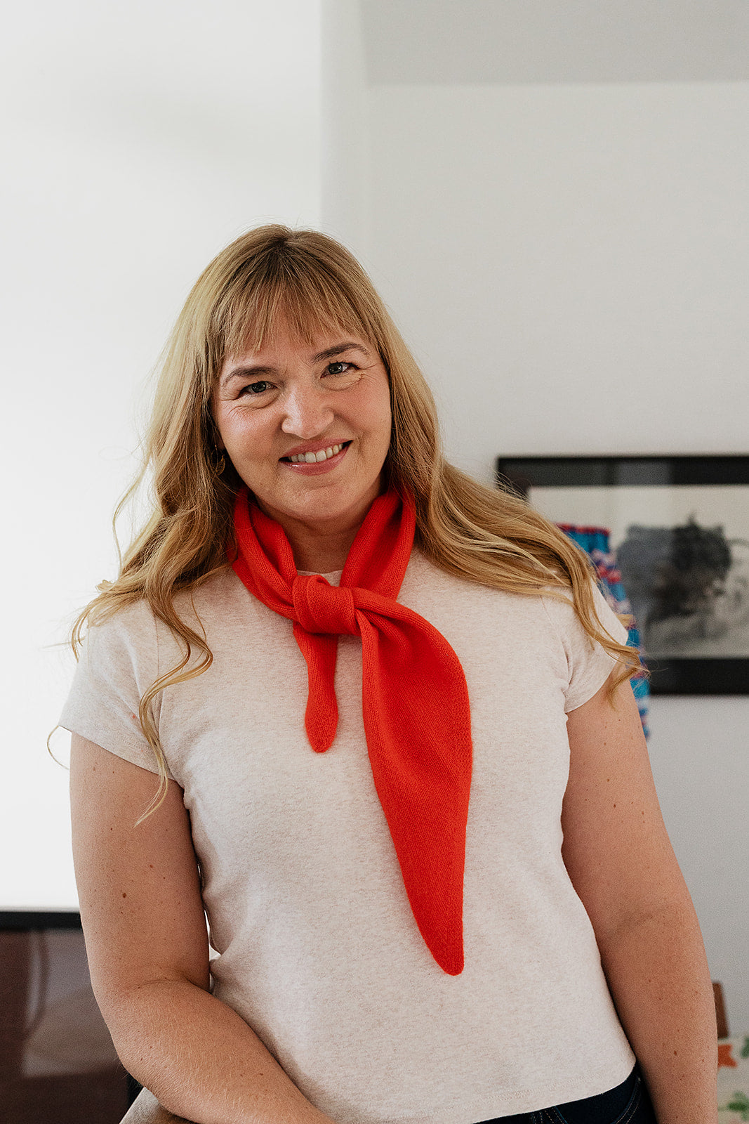 Cashmere triangle neck scarf in tangerine orange red.