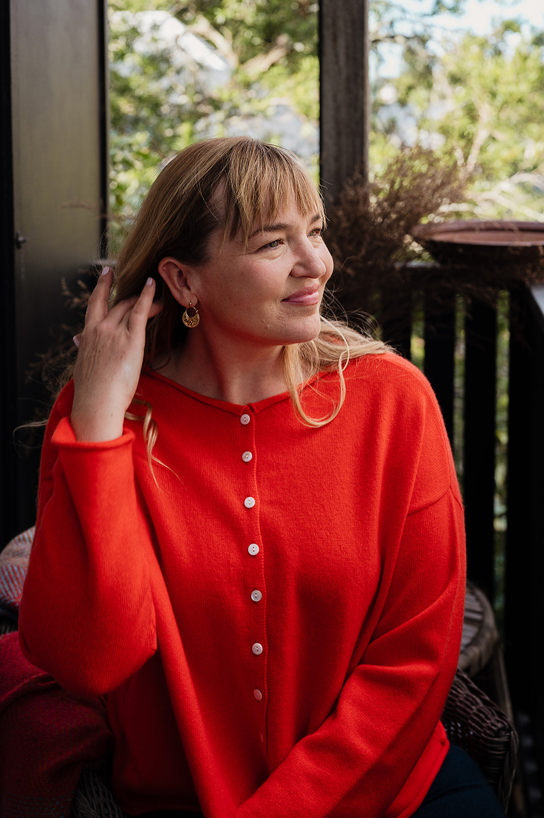 One size reversible cashmere cardigan in tangerine red orange.