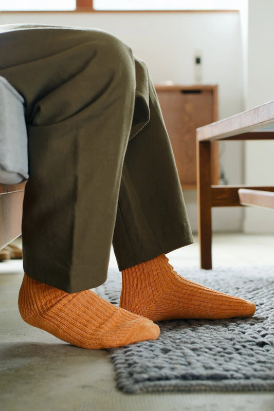 Nishiguchi made in Japan Boston cotton hemp crew length socks in lantern orange.