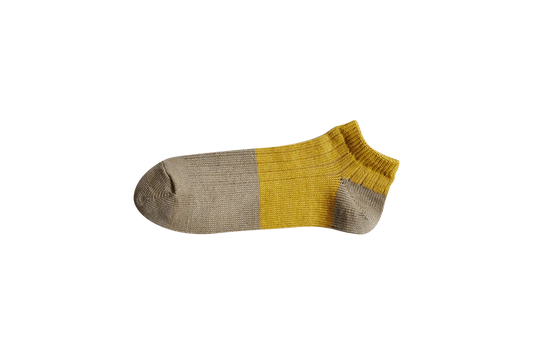 Nishiguchi Kutsushita linen cotton anklet in natural and yellow.