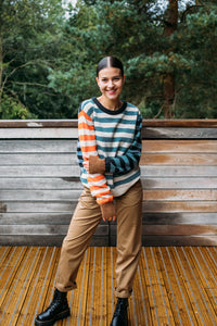 Eribe Stobo stripe reversible lambswool sweater in Phoebe, light blue and navy, cream and  terracotta and teal stripes.