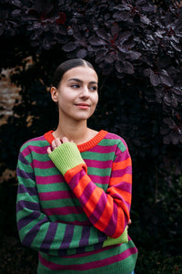 Eribe Stobo stripe reversible lambswool sweater in Rosa - pink and orange and red and purple anda green and fuchsia stripes.