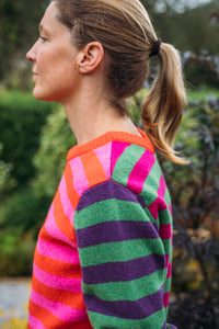 Eribe Stobo stripe reversible lambswool sweater in Rosa - pink and orange and red and purple anda green and fuchsia stripes.