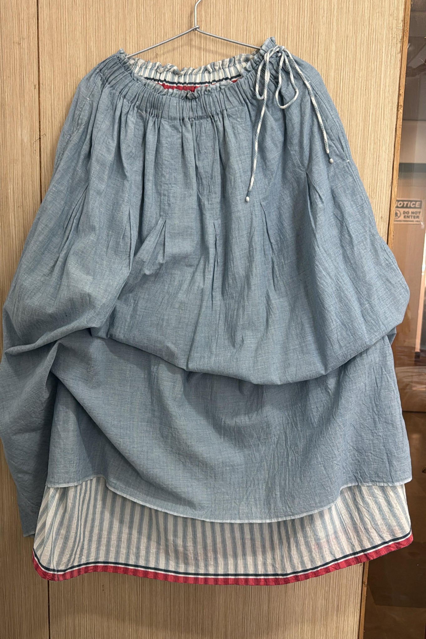 Dve Neela reversible cotton skirt in light denim blue, and blue and white stripe.