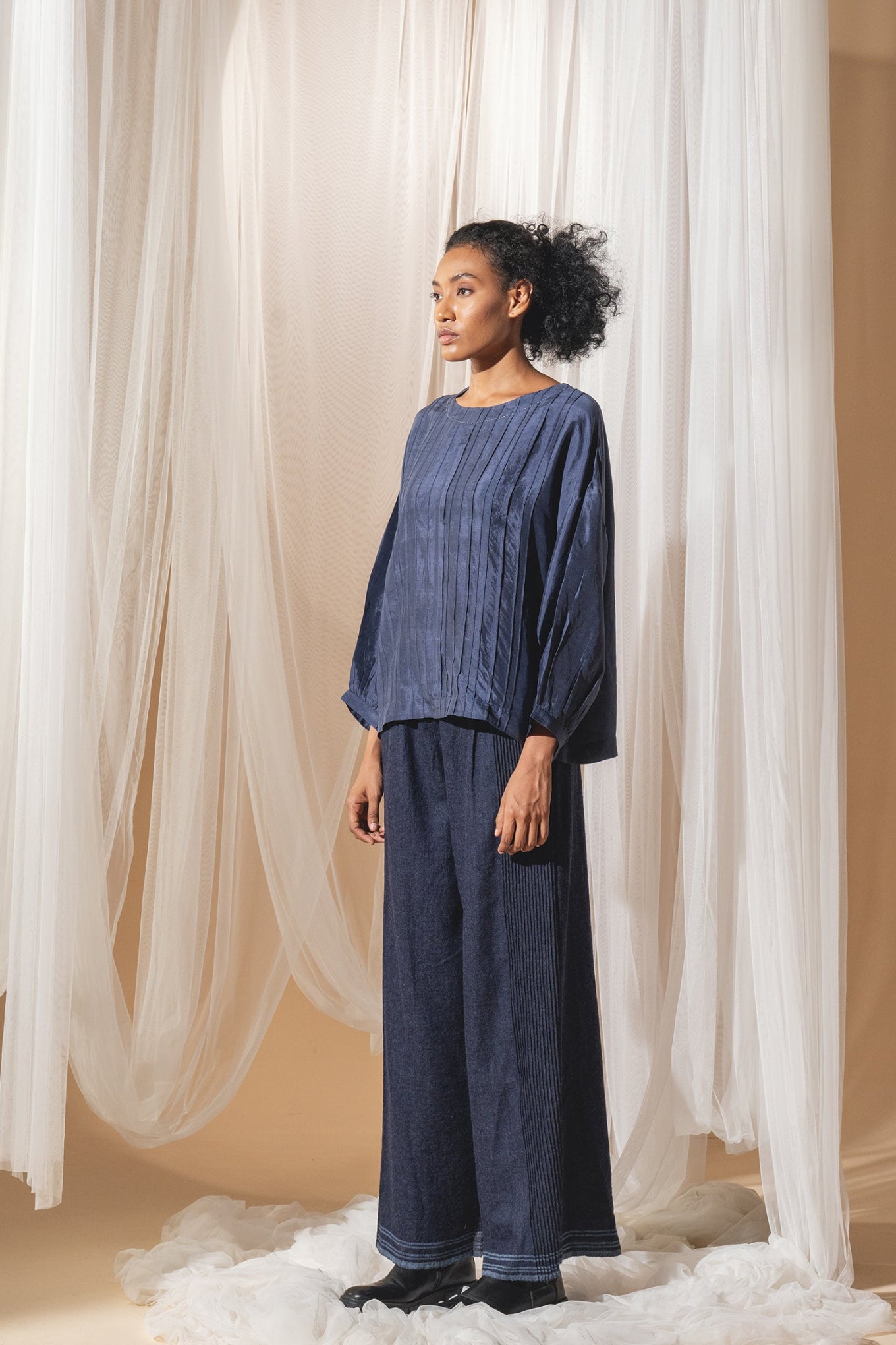 DVE Collection Mahira pintucked silk top in blue.