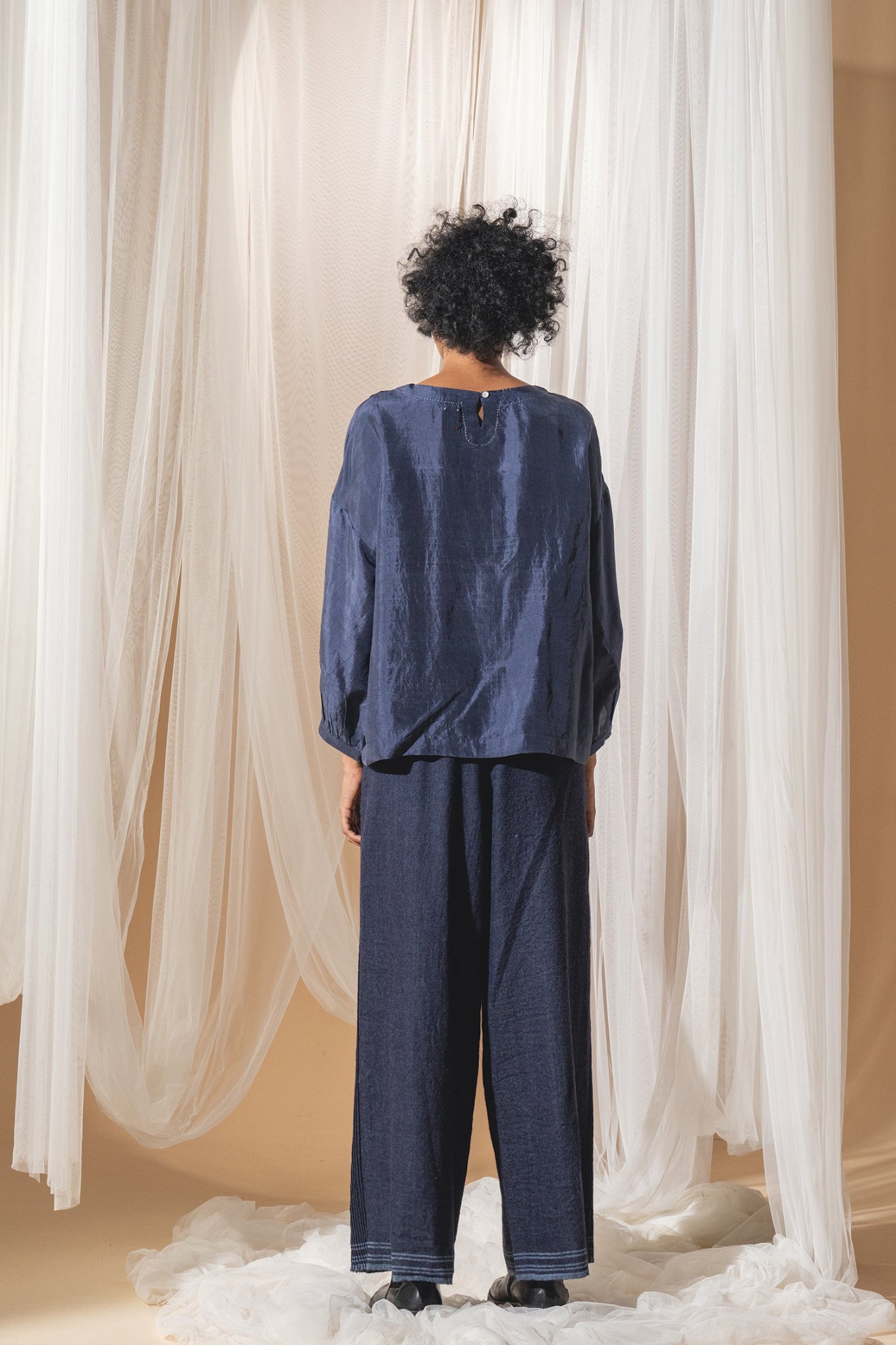 DVE Collection Mahira pintucked silk top in blue.