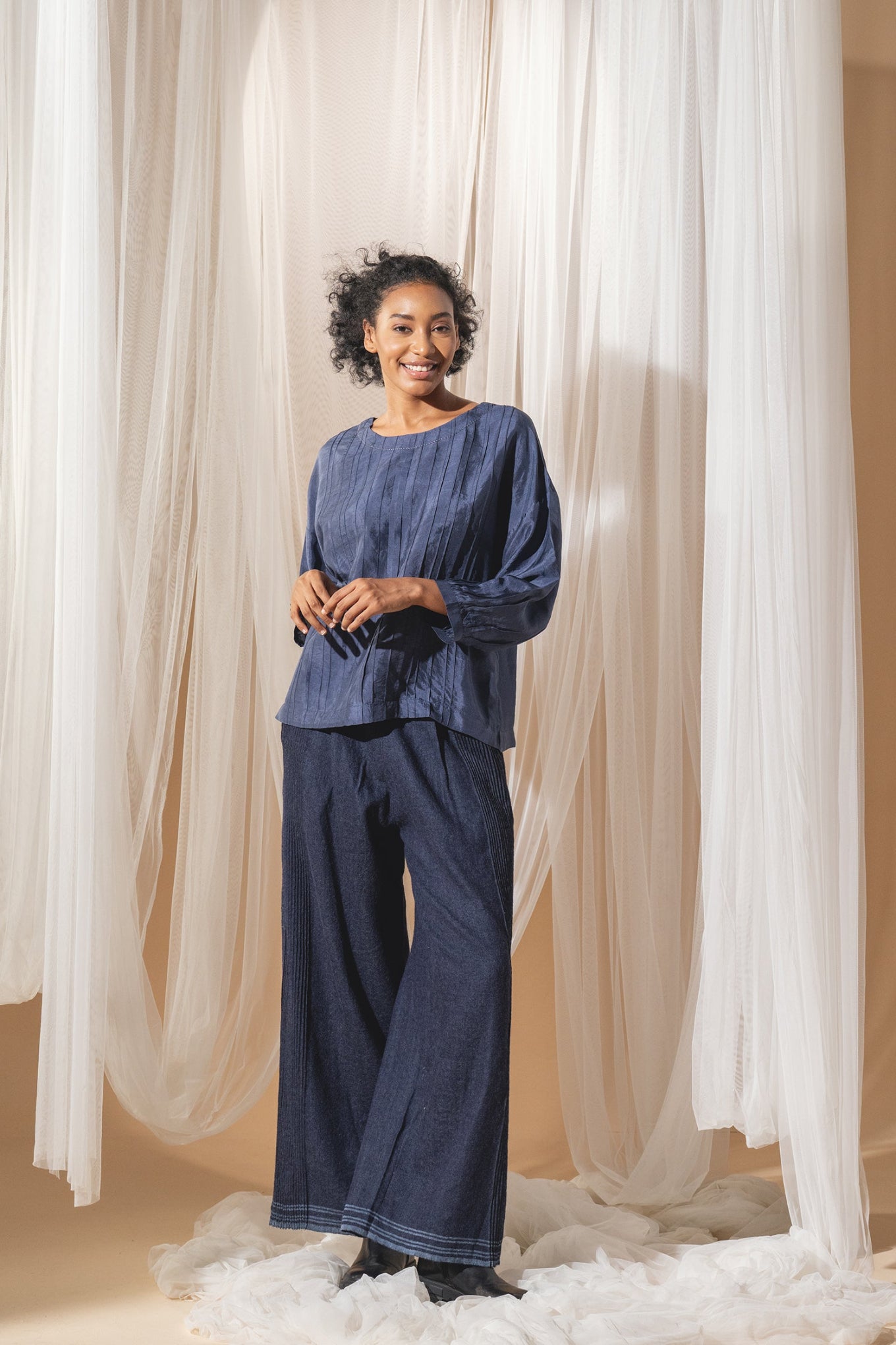 DVE Collection Mahira pintucked silk top in blue.