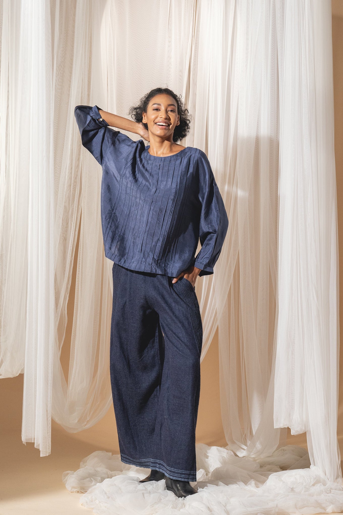 DVE Collection Mahira pintucked silk top in blue.