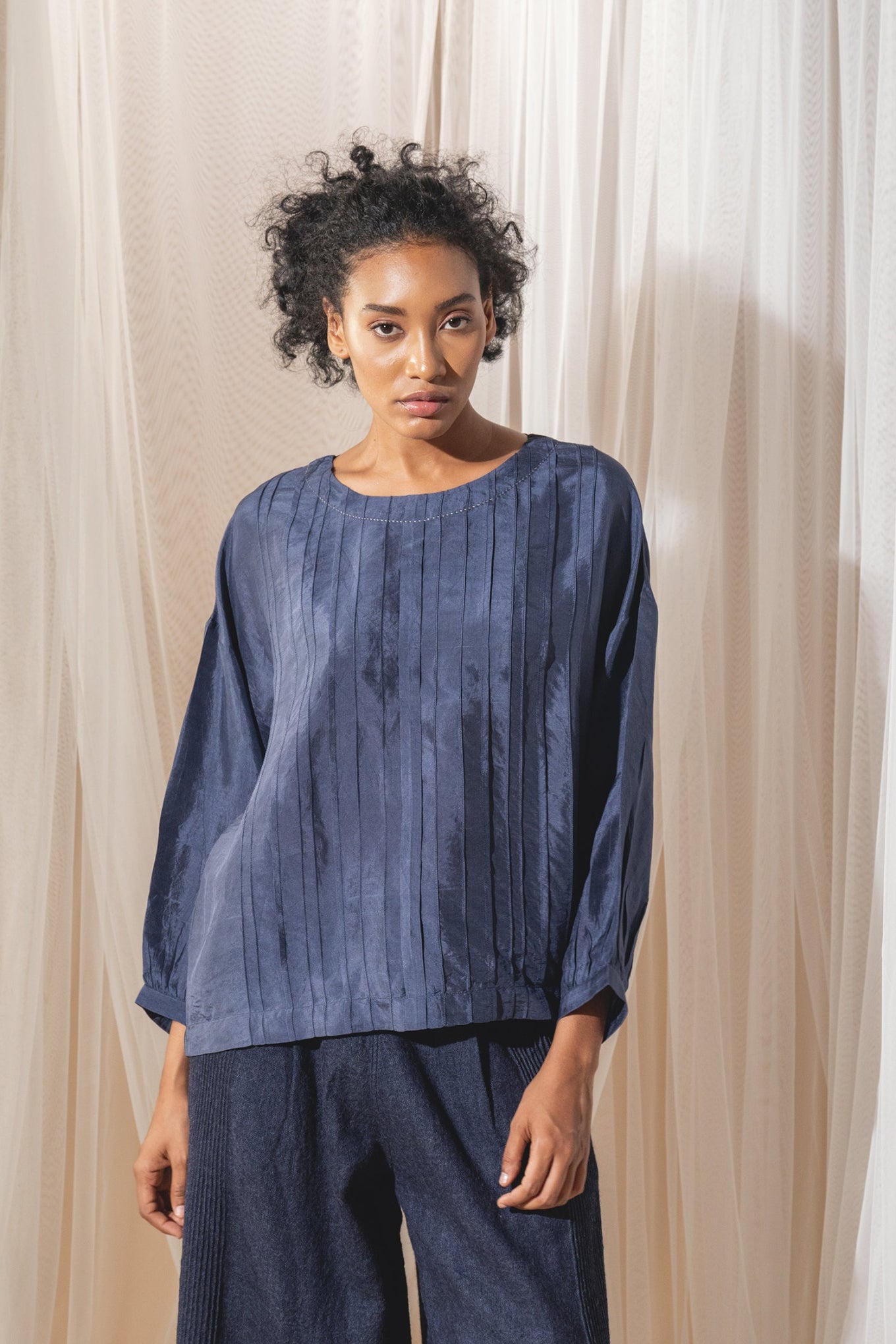 DVE Collection Mahira pintucked silk top in blue.
