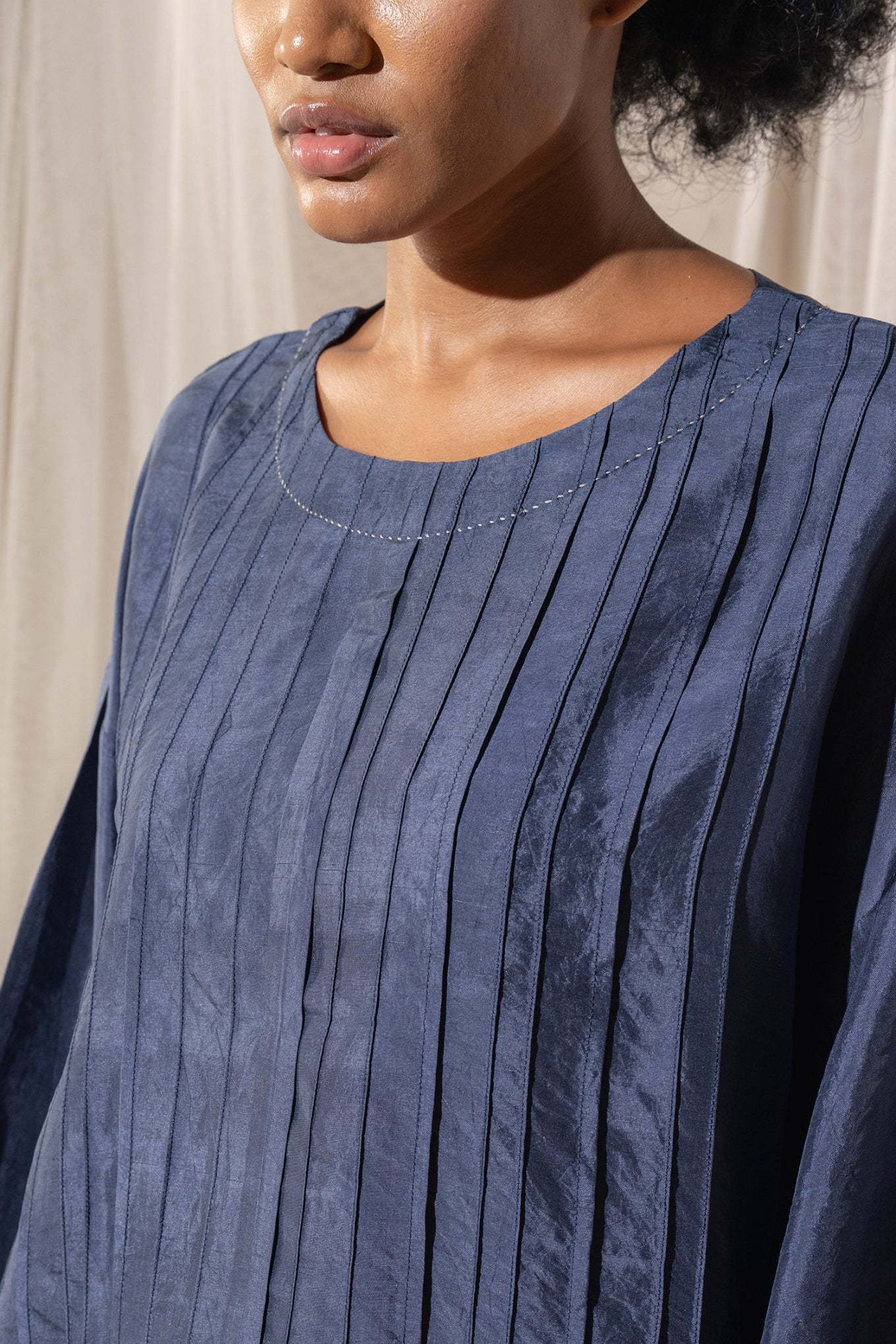 DVE Collection Mahira pintucked silk top in blue.