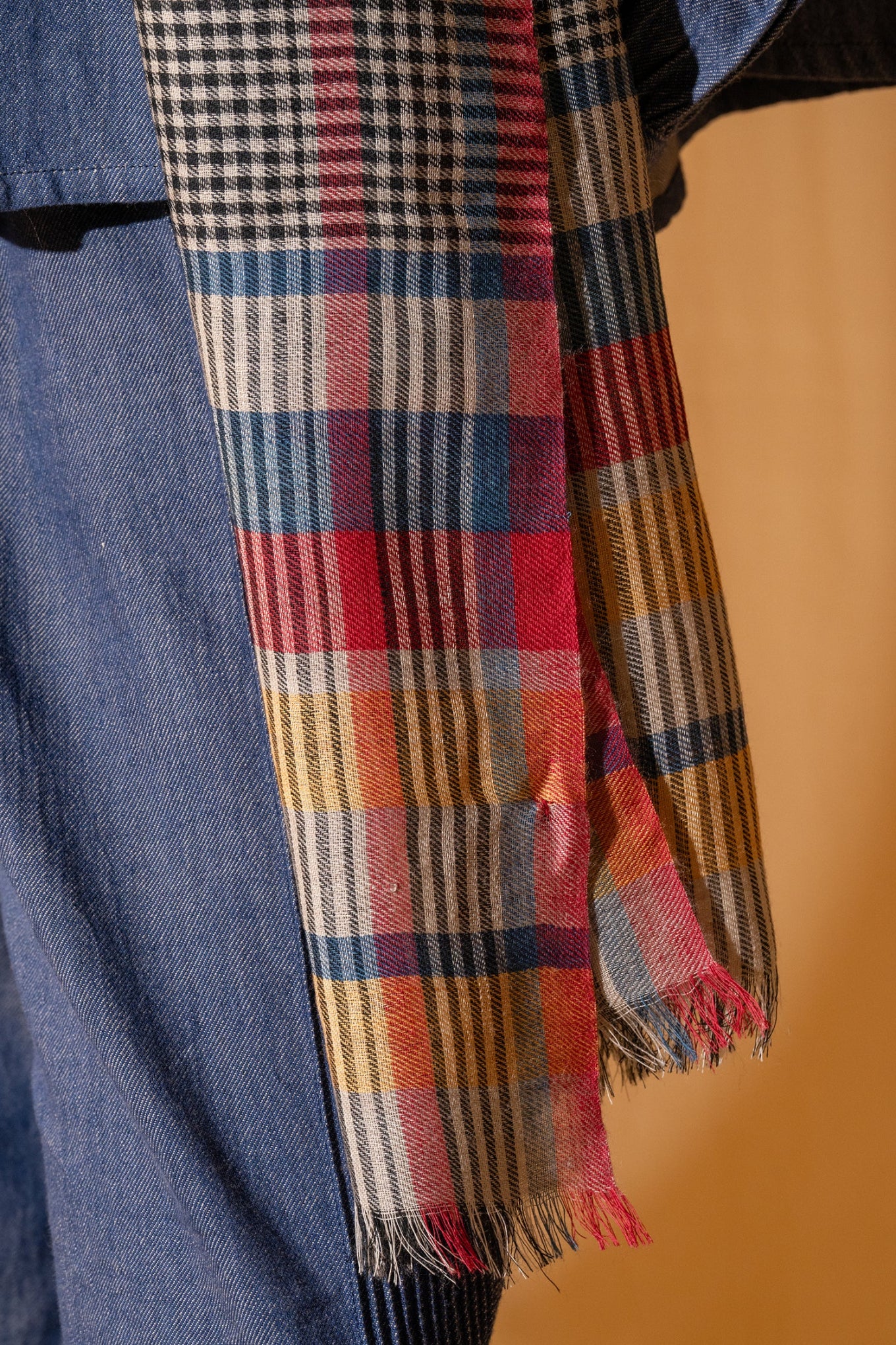 DVE wool check scarf with red, navy and yellow stripes.