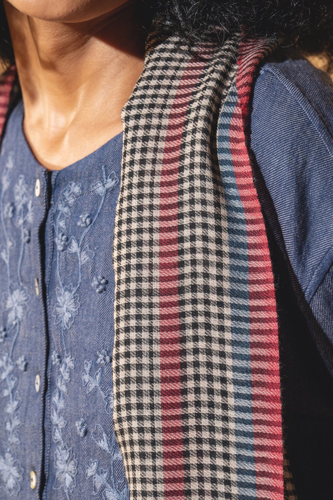 DVE wool check scarf with red, navy and yellow stripes.