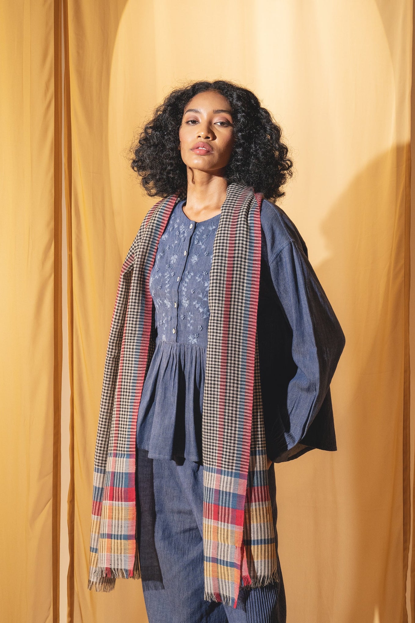 DVE wool check scarf with red, navy and yellow stripes.