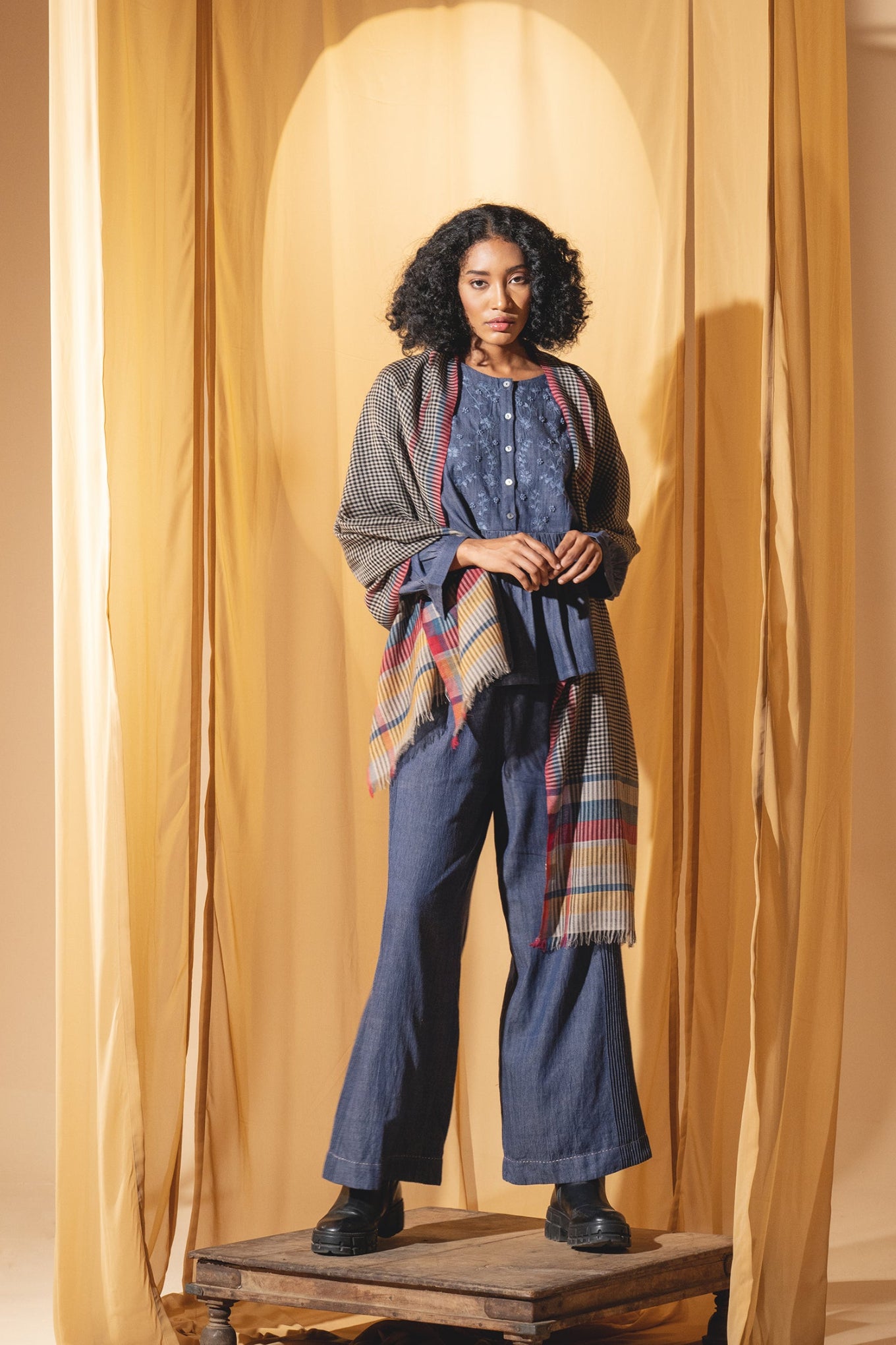 DVE wool check scarf with red, navy and yellow stripes.