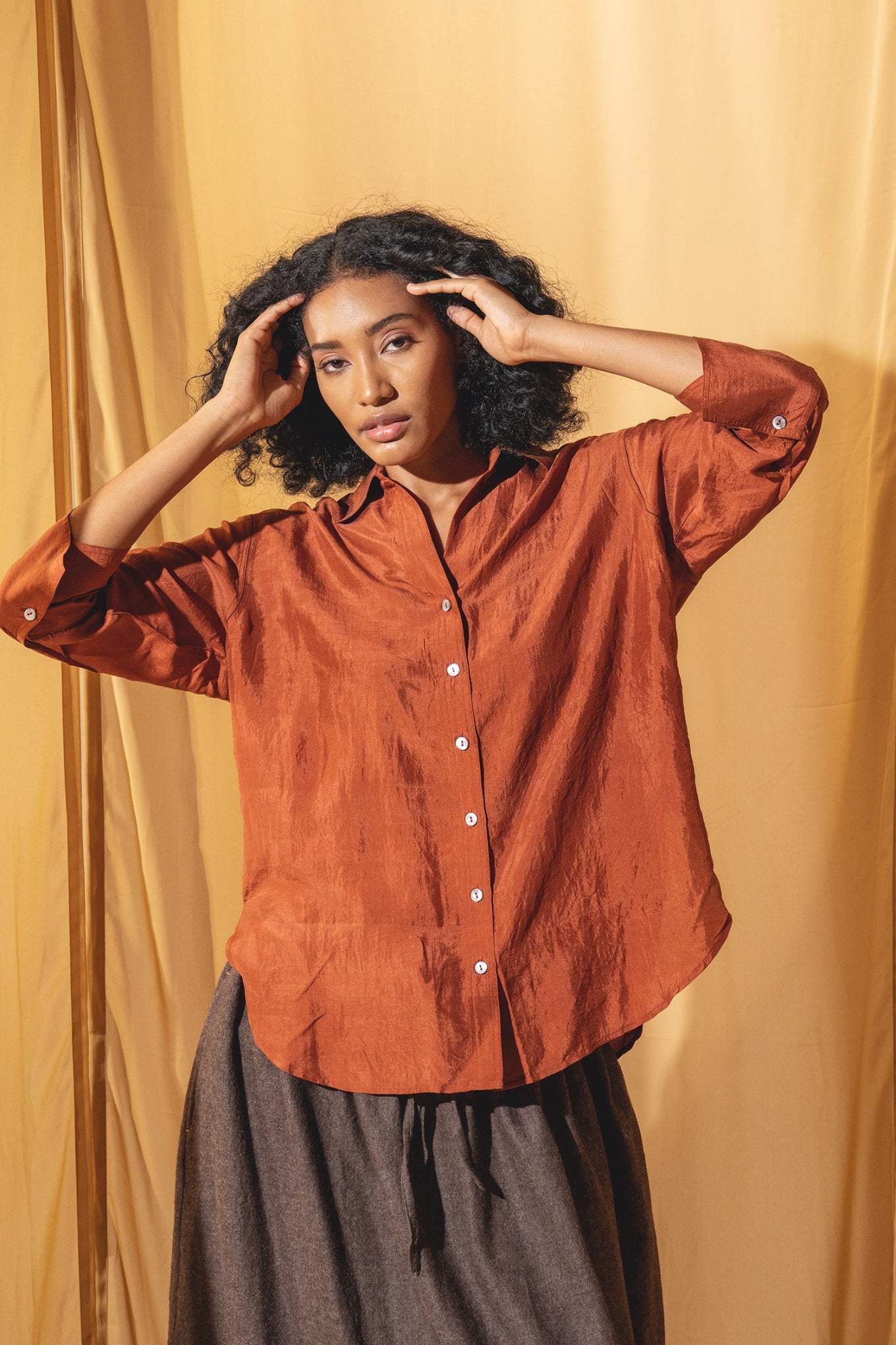 Dve Collection Arha silk button up blouse in rust.